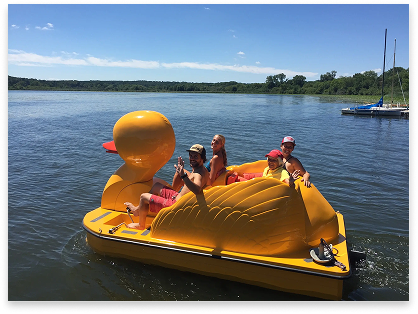Family on a duck shaped paddle-boat